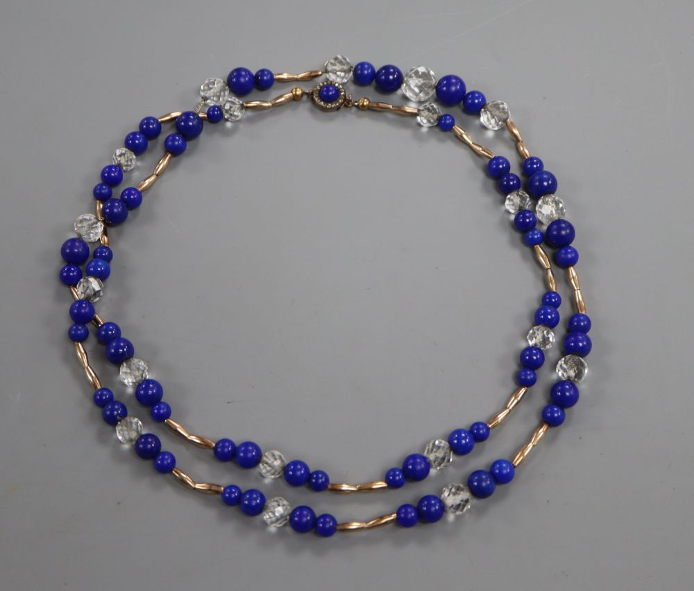 A yellow metal, lapis lazuli and paste set necklace, with rose cut diamond set clasp, 88cm, gross 59 grams.